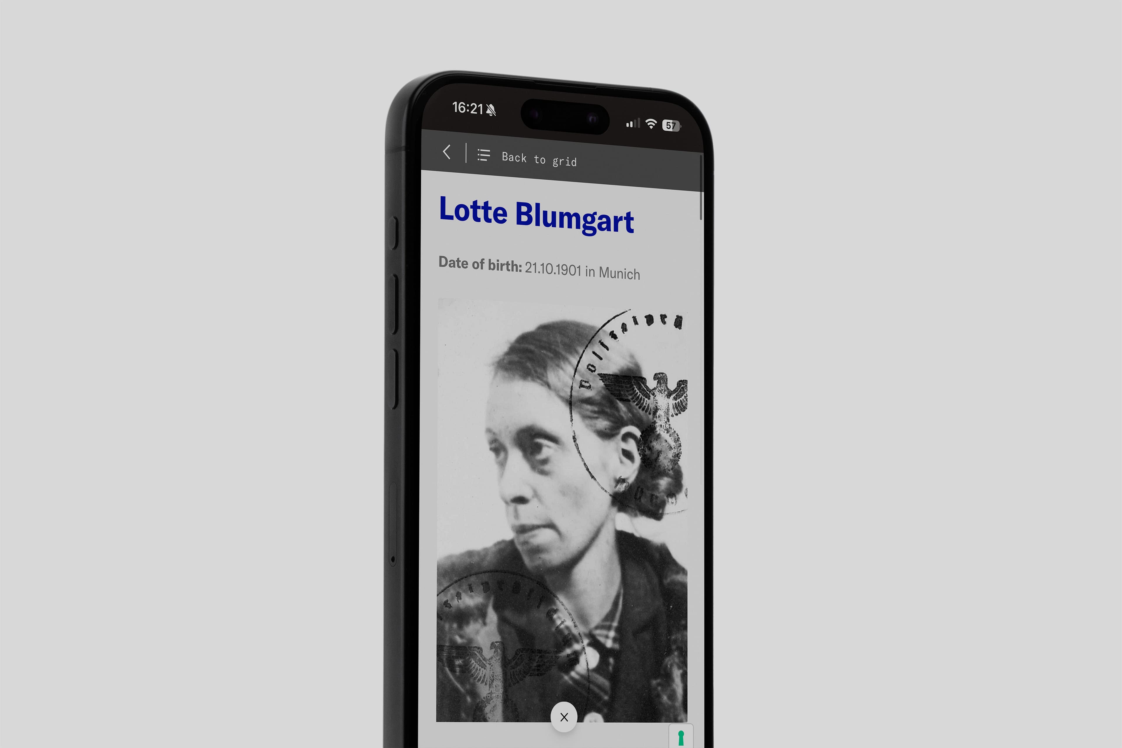 Smartphone displaying a grayscale photo of a woman labeled "Lotte Blumgart" with a birthdate of 21.10.1901 in Munich. The image appears to have official stamps over it.