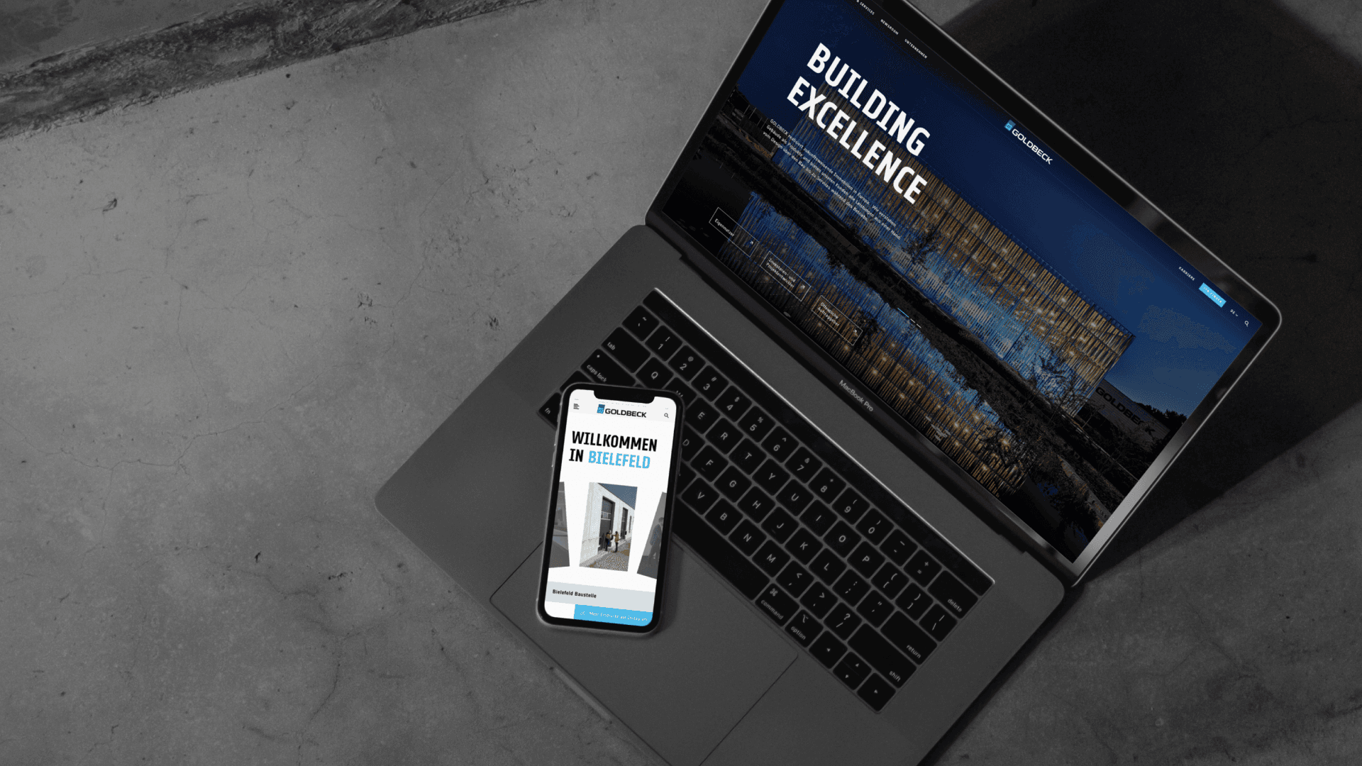 &why: GBK - Mockup of smartphone and laptop with website